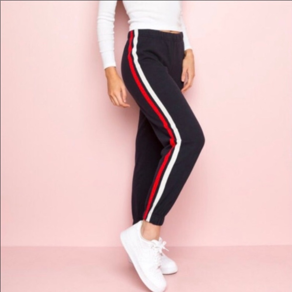 Navy blue sweatpants with red and white stripes